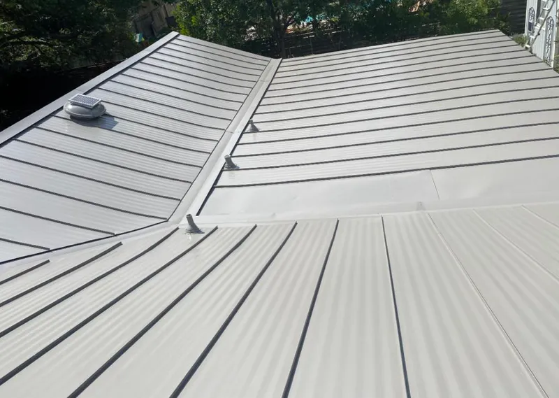 Solar attic fan installed on a metal roof for Roof Ventilation in Baker City